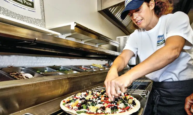 A pizza being made at Leonardo's Pizza in Portland, Maine.