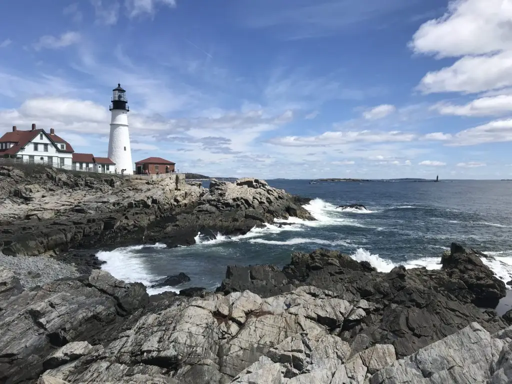 The Portland Headlight on a bright, cloudy day in Cape Elizabeth, Maine.
