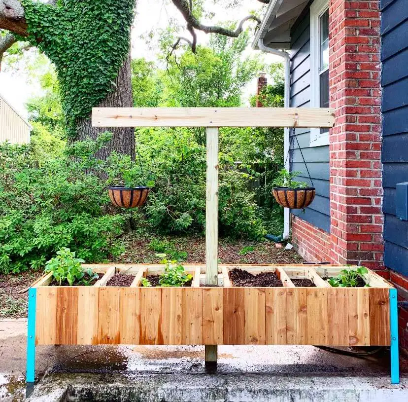 Raised garden bed with compost bins