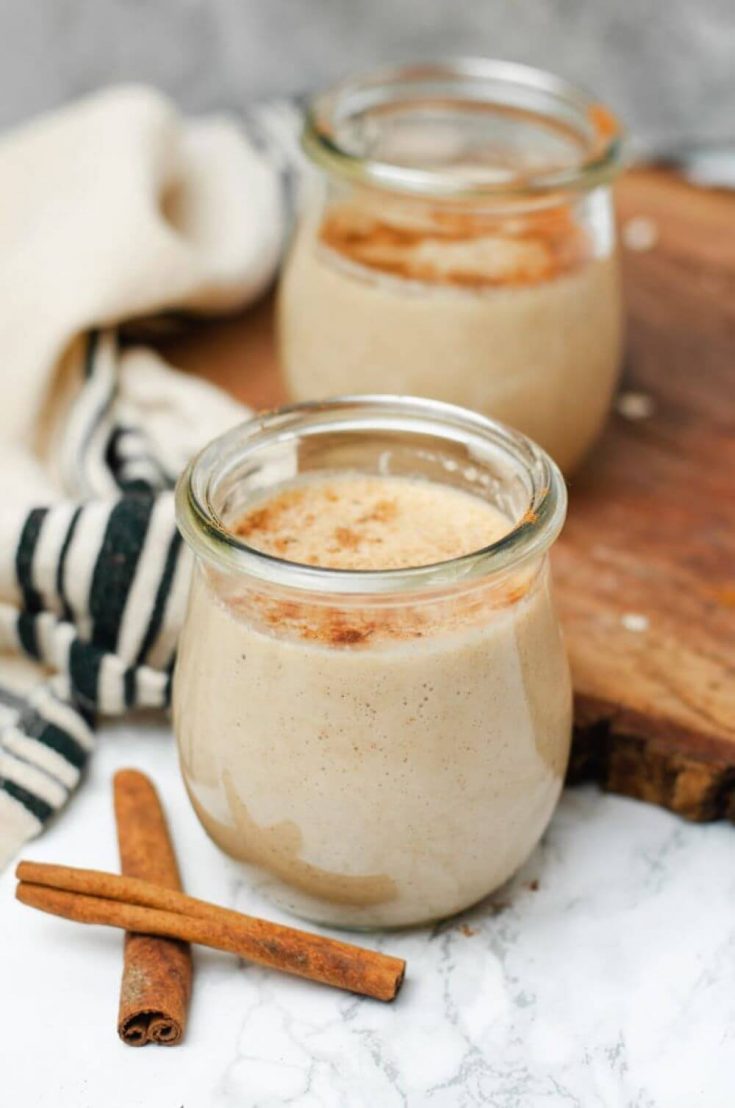 Two small glasses of apple cinnamon smoothie.