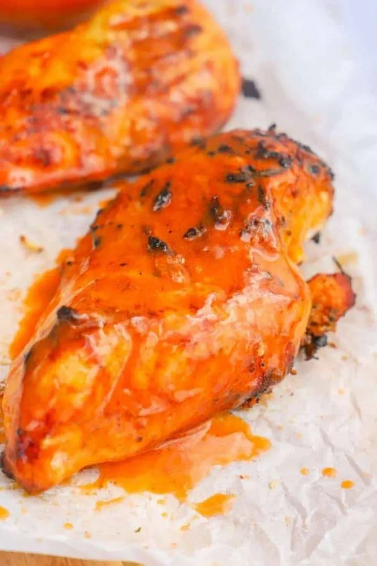 Two breasts of grilled buffalo chicken.