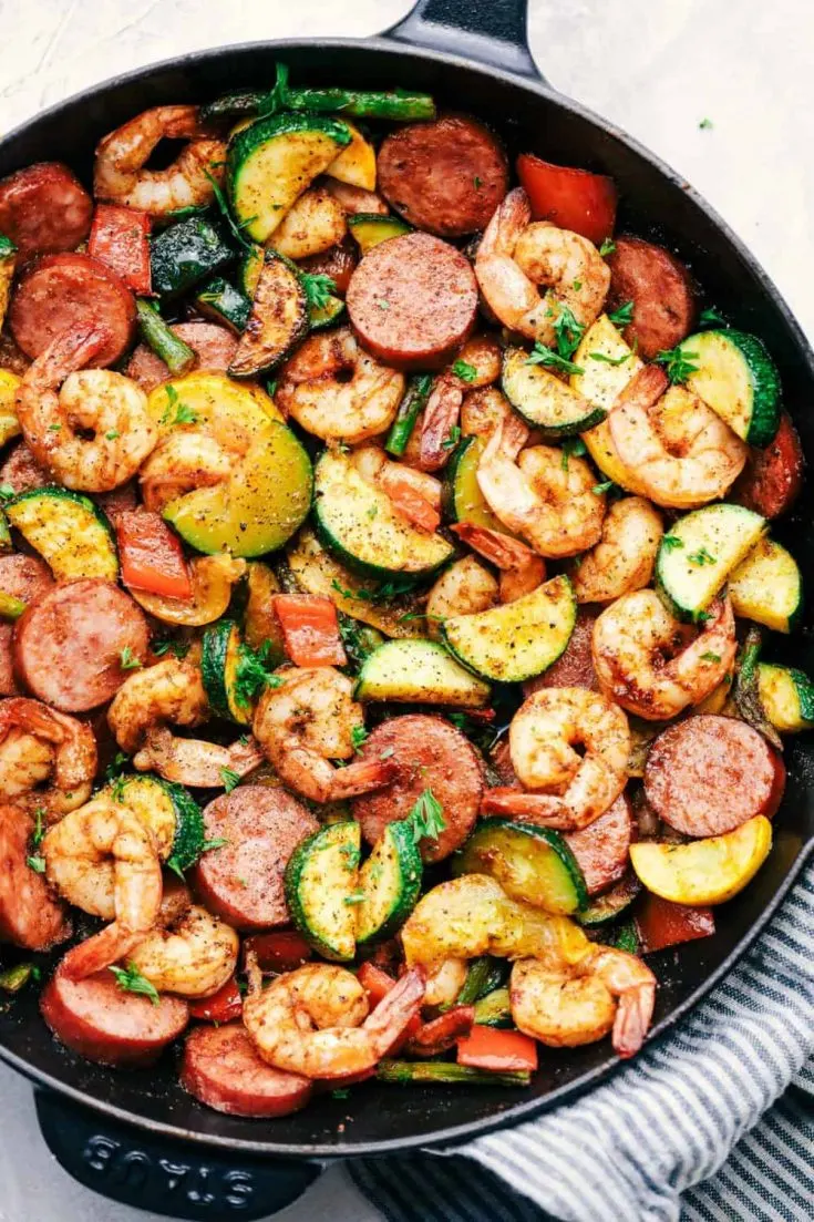 A delicious pan full of healthy cajun shrimp and sausage vegetable skillet.