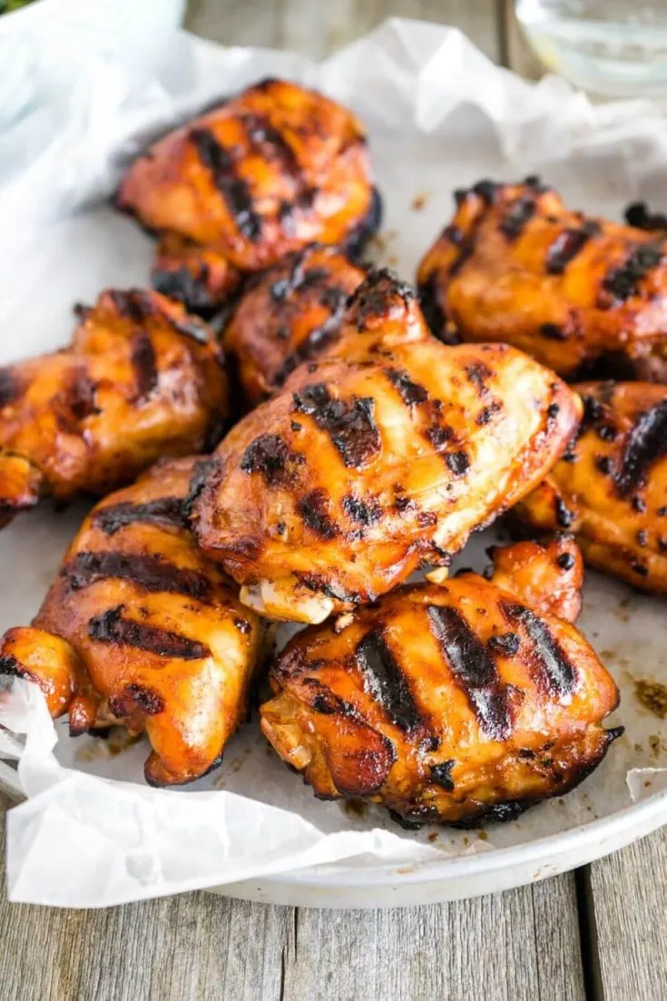 A large tray of honey sriracha grilled chicken.
