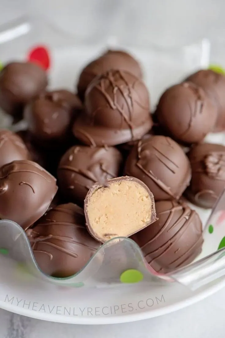 A plate of many delicious no-bake peanut butter balls.