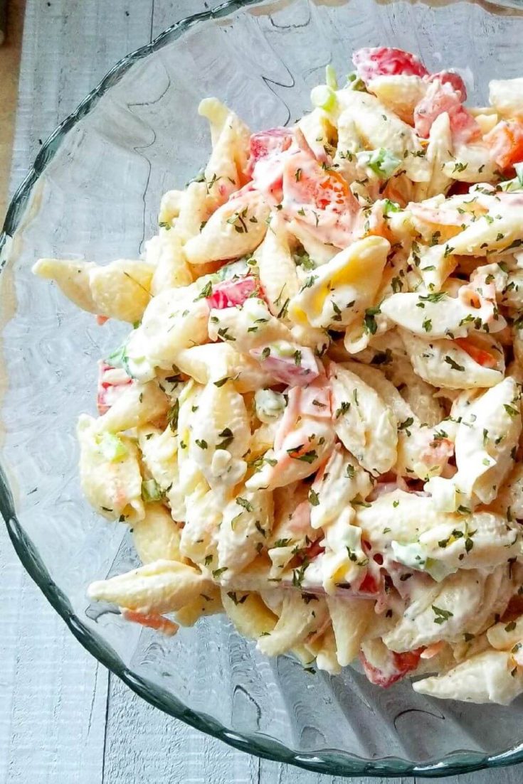 A large bowl of delicious ranch pasta salad.