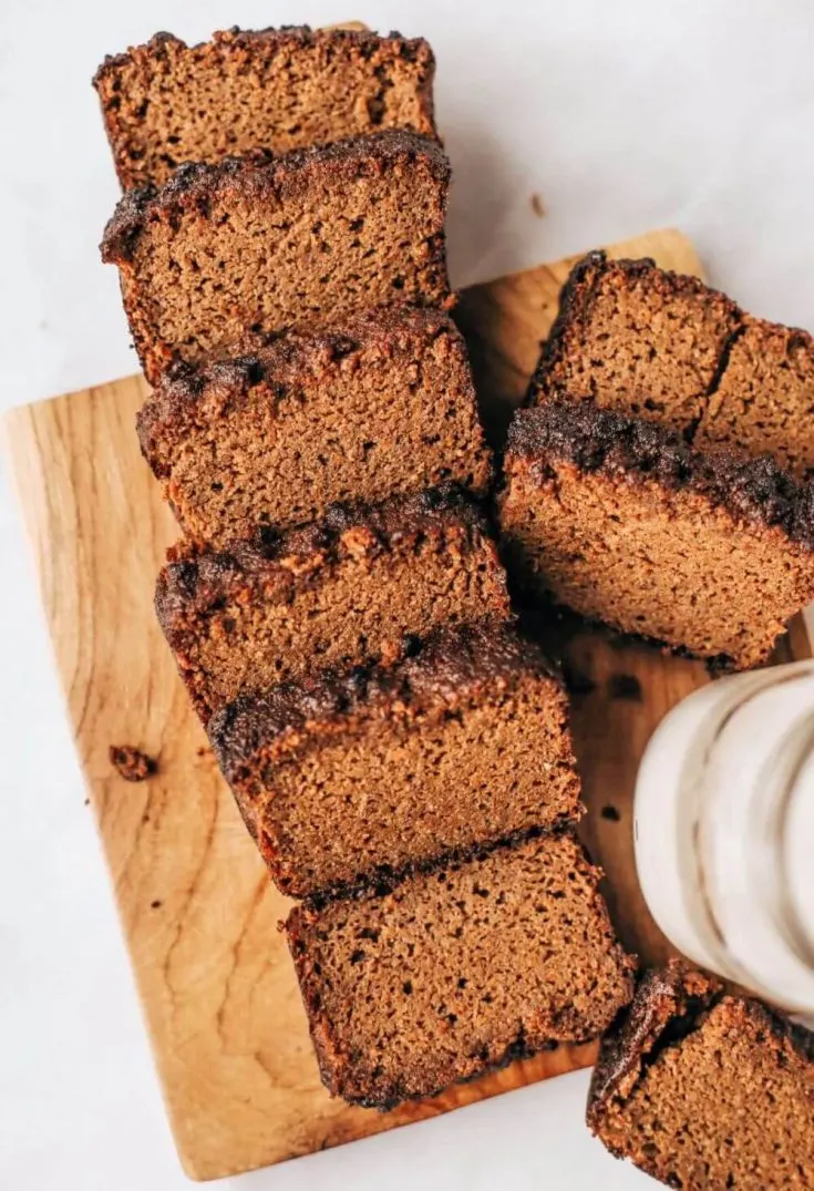A board full of sweet potato gingerbread loaf slices.