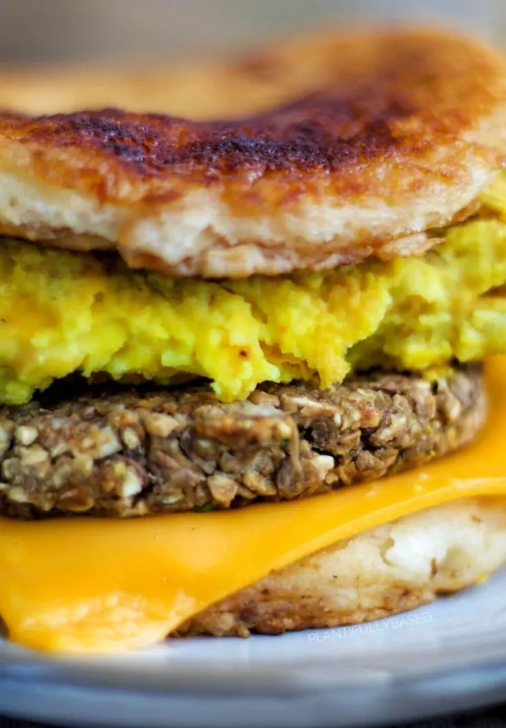 A close-up of a vegan mcgriddle breakfast sandwich.