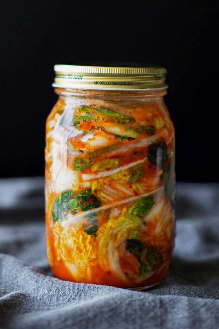 A large jar of colorful vegan kimchi.