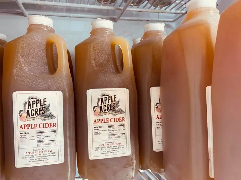 Several half gallon jugs of Apple Acres' apple cider.