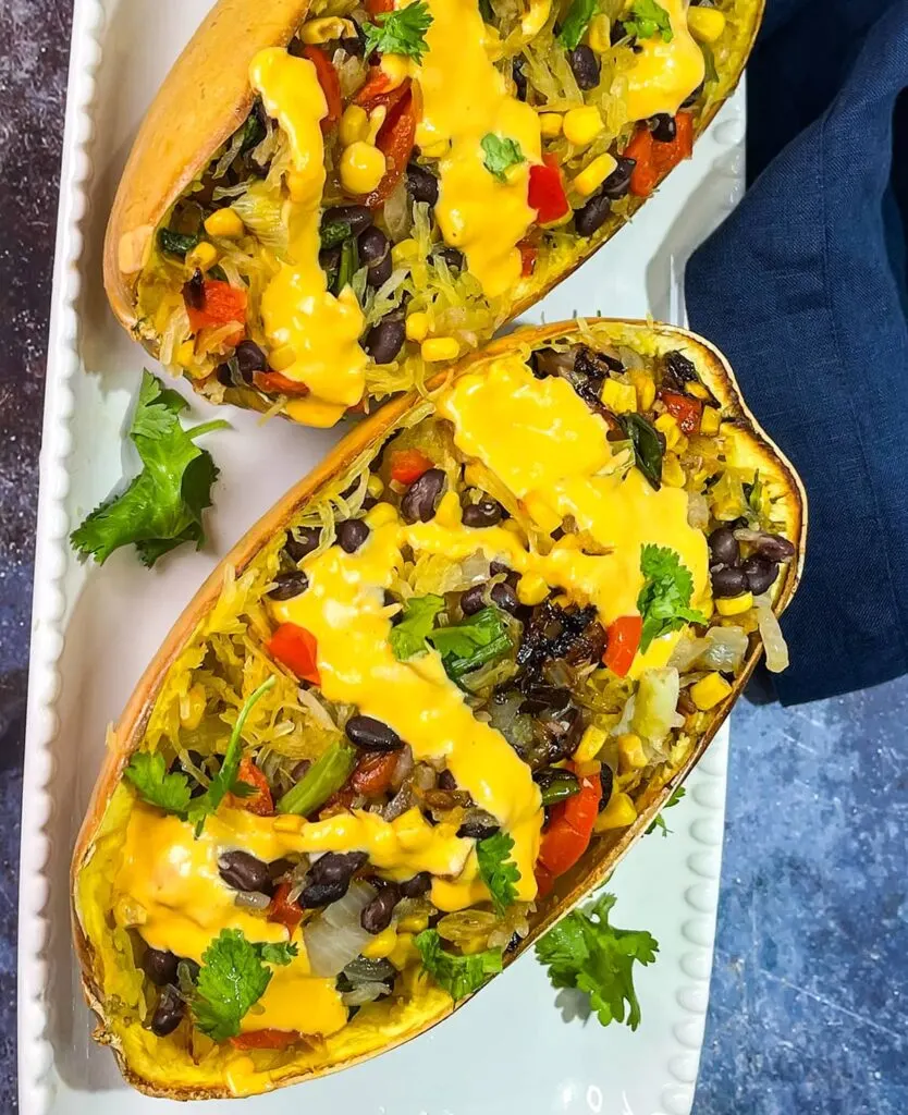Two halves of healthy and flavorful southwestern stuffed spaghetti squash.